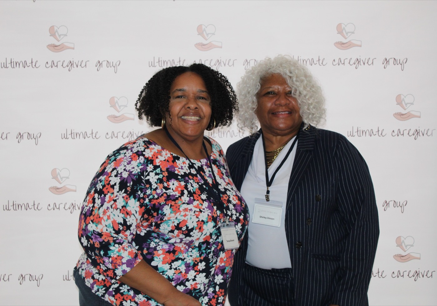 Attendees smile together at the conference.